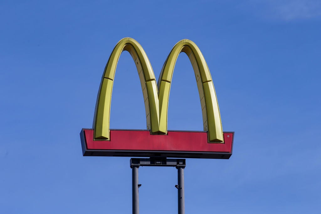 A McDonald's logo is seen on a sign at the fast food