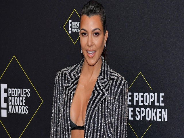 Kourtney Kardashian Shows off Growing Baby Bump in Pink Bikini