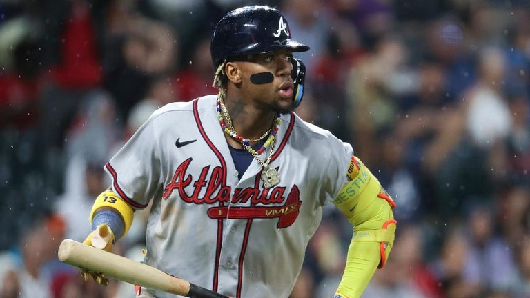 Braves' Ronald Acuña Jr. Knocked Down by Two Fans During Game Against Rockies