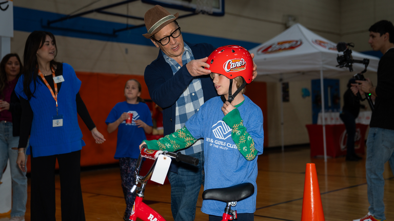 Rob Schneider and Raising Cane's Deliver Holiday Bikes to Arizona Kids (Exclusive)