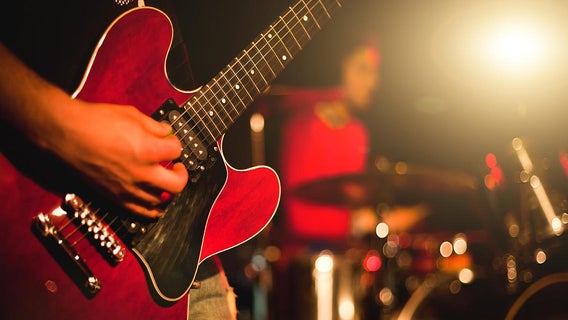 rock-band-man-playing-guitar