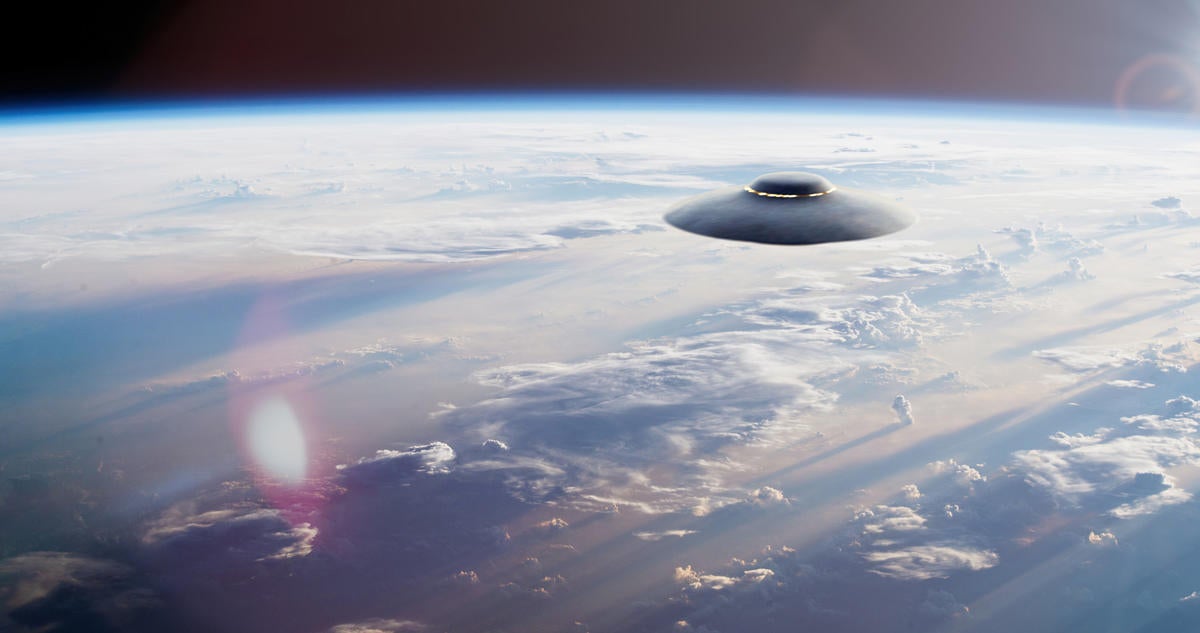 UFO saucer hovered over the planet Earth