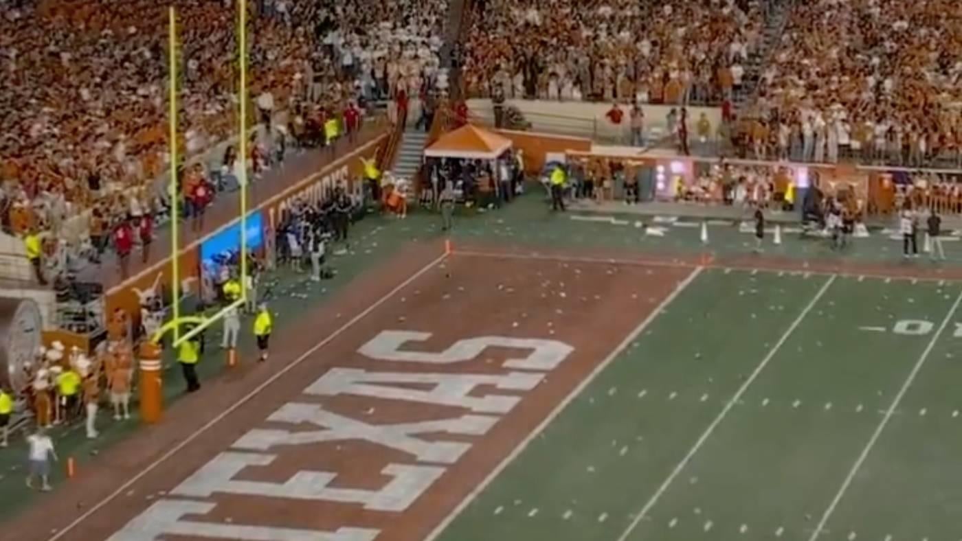 WATCH: Texas fans pelt field with trash over controversial pass interference call that refs end up overturning