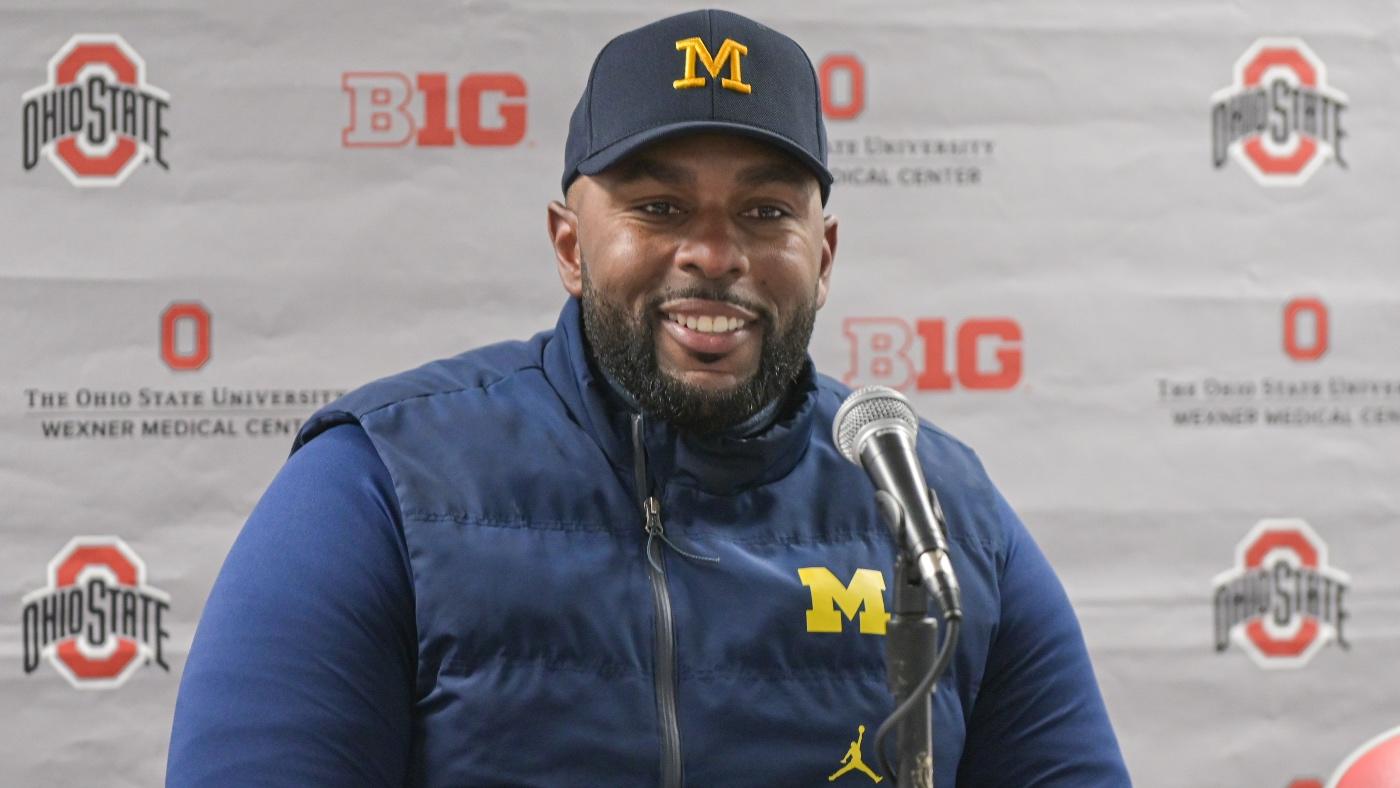 WATCH: Michigan's Sherrone Moore jabs Ohio State again by planting imaginary flag during basketball game