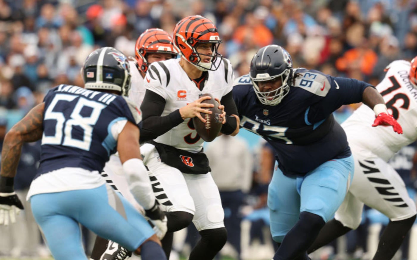 WATCH: Titans' T'Vondre Sweat throws nasty stiff arm on big man fumble return vs. Bengals