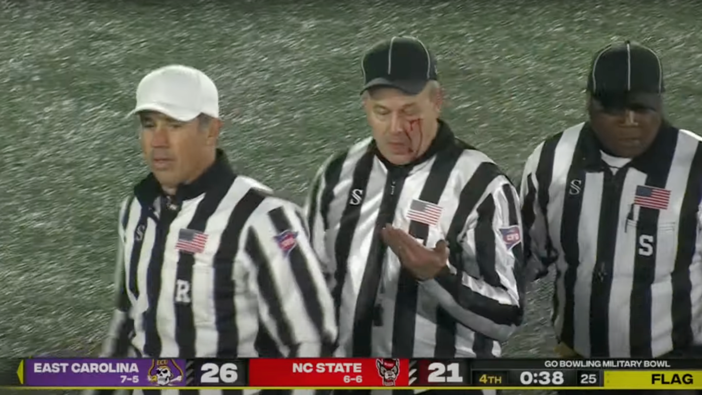 WATCH: Ref bloodied as brawl breaks out between NC State and East Carolina in final minute of Military Bowl