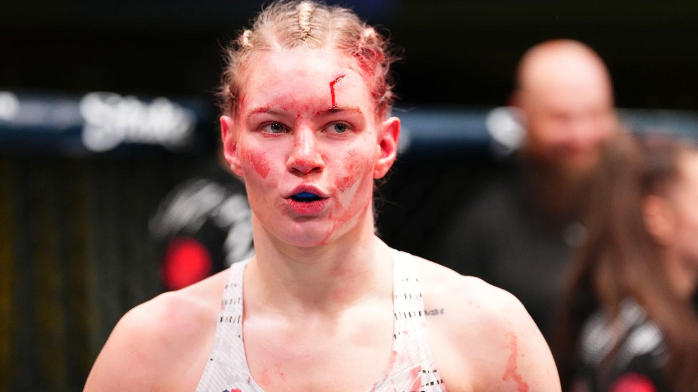 UFC fighter Viktoriia Dudakova slaps her coach after he tried to console her following TKO loss