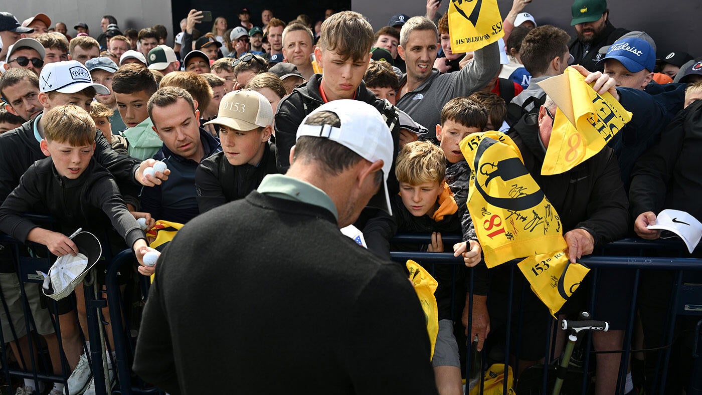 https://sportshub.cbsistatic.com/i/2025/07/15/da17dd10-5a77-4172-b7a0-de90eddd3e84/rory-mcilroy-signing-open-portrush-g.jpg