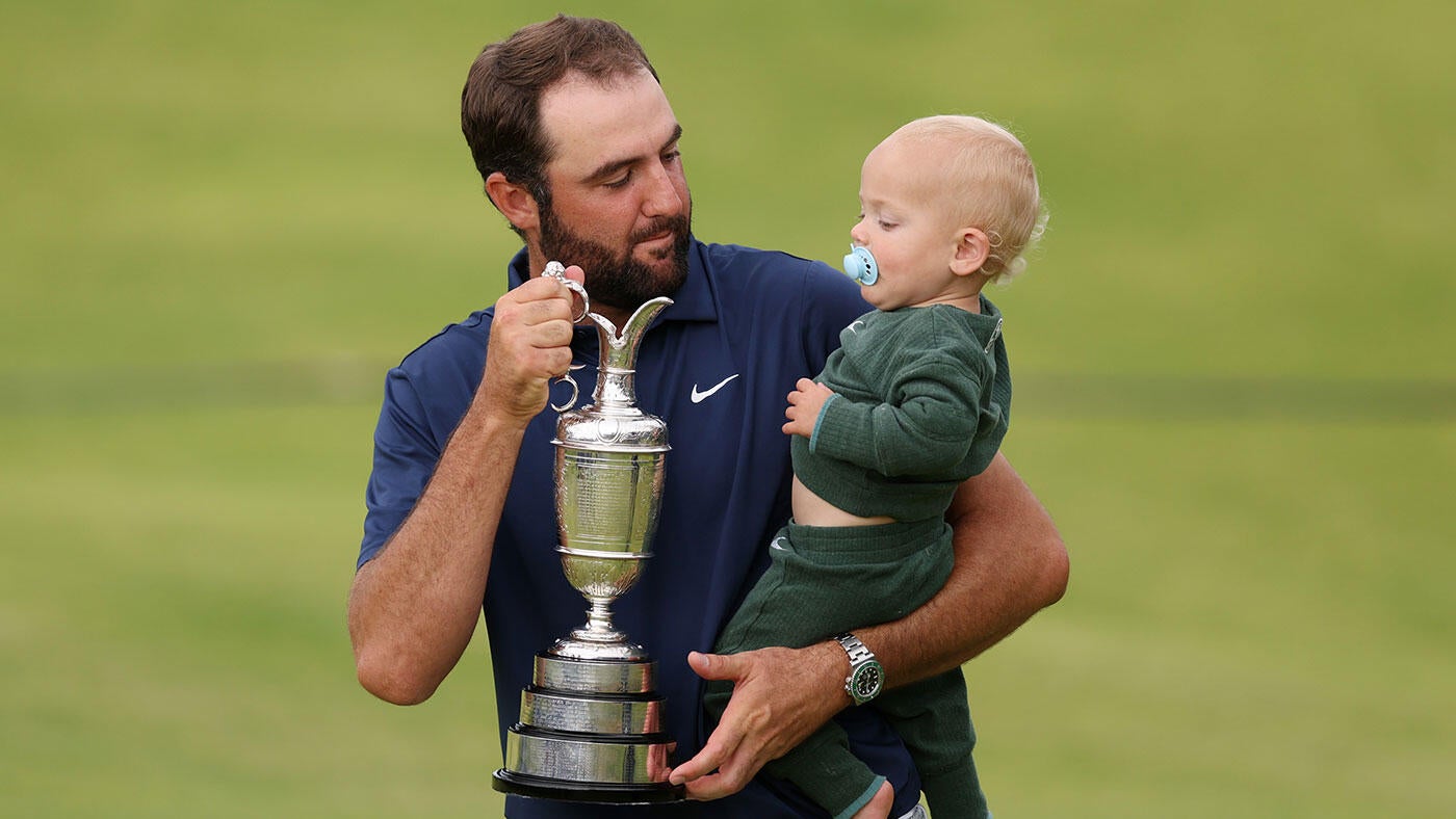 https://sportshub.cbsistatic.com/i/2025/07/20/8d824bd7-1456-42ef-9a1f-ffaa9d94836d/scottie-scheffler-claret-jug-baby-g.jpg