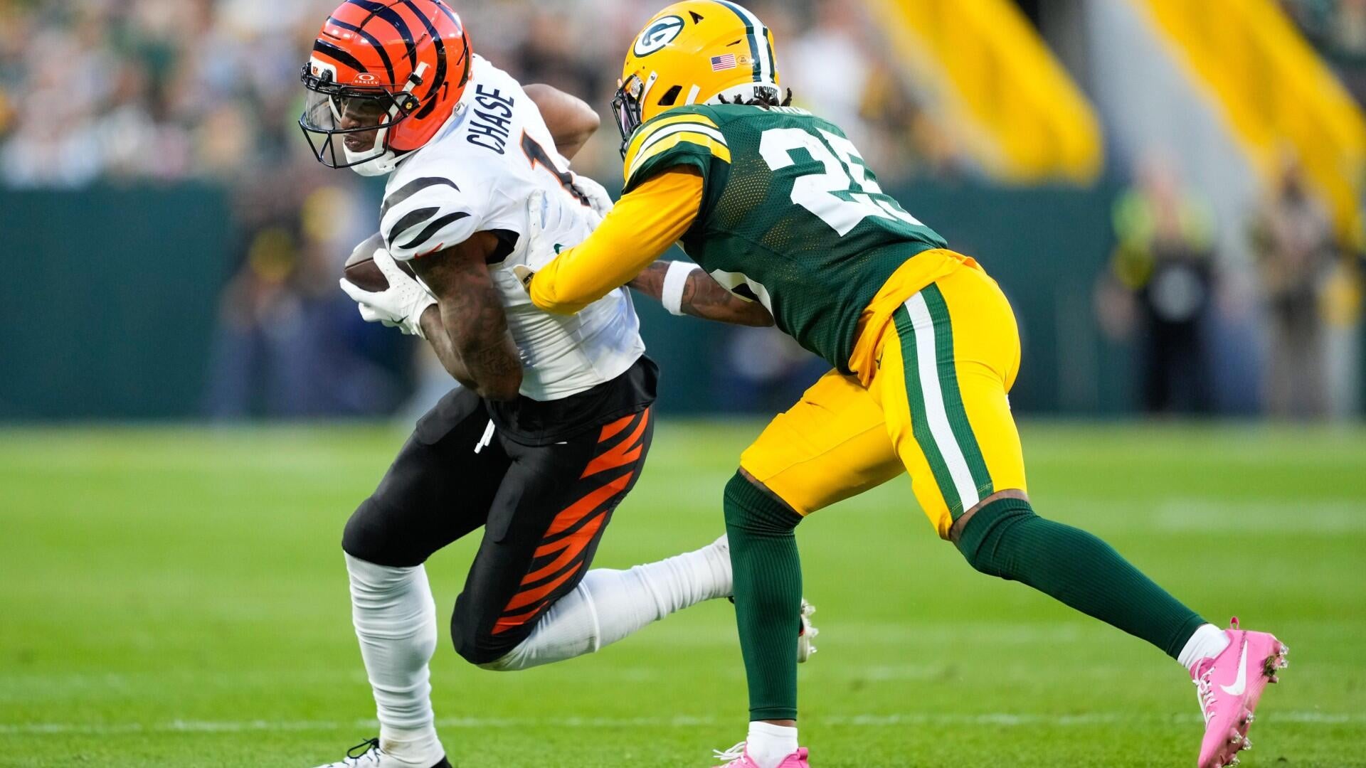 Ja'Marr Chase runs from a Green Bay defender