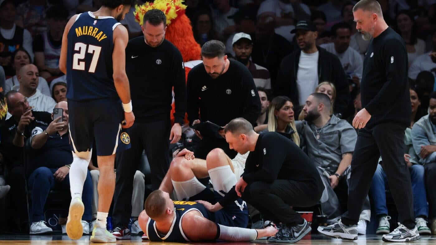Nikola Jokić injury: Nuggets star exits vs. Heat after suffering left knee injury