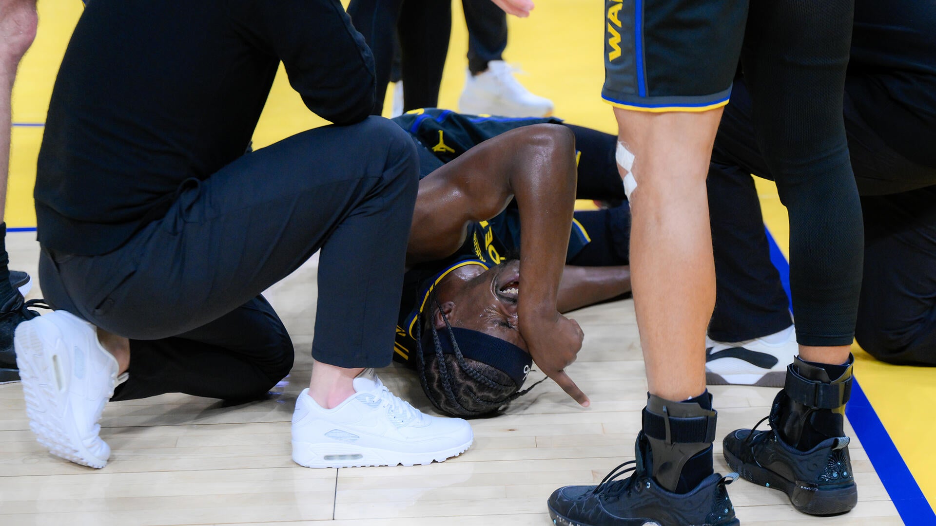 Jimmy Butler suffers apparent serious knee injury: Warriors star helped to locker room during game