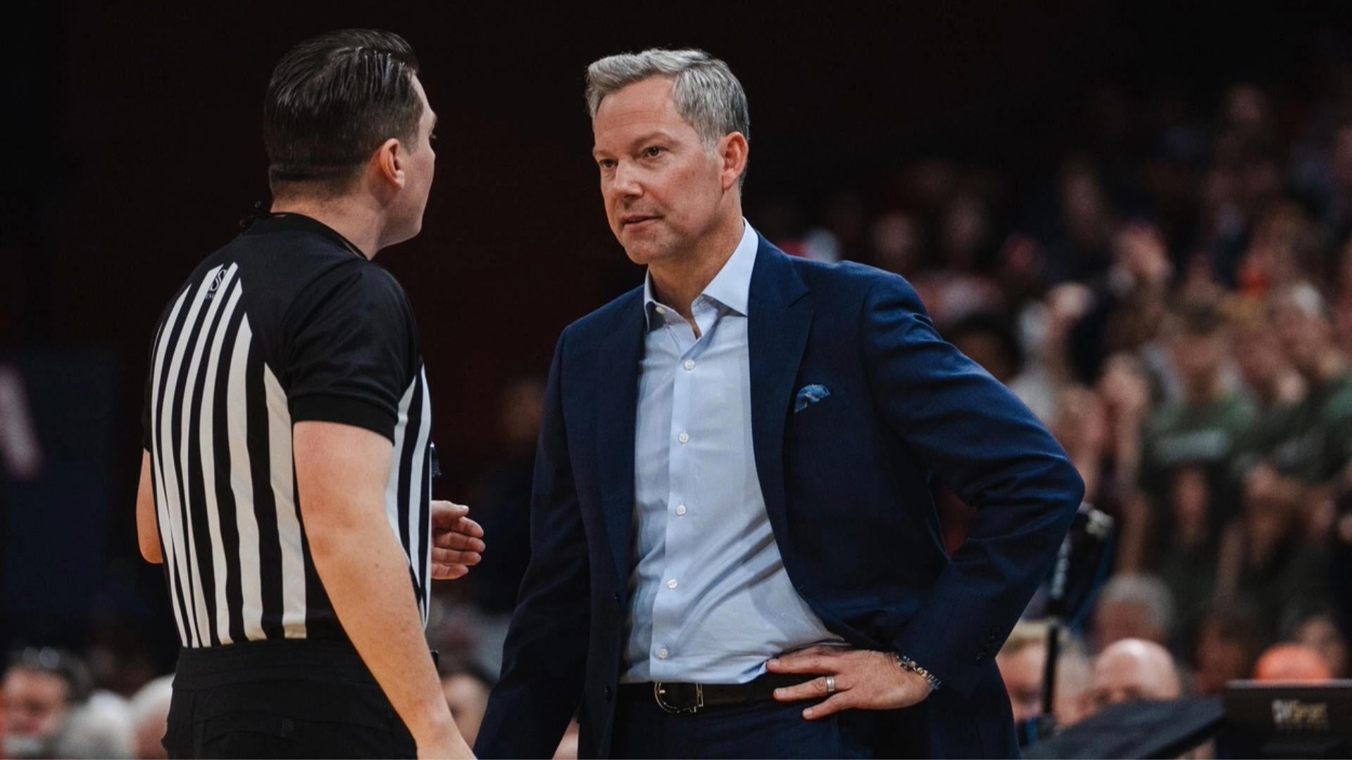 Virginia coach Ryan Odom on the bench giving UVA a lift against Syracuse