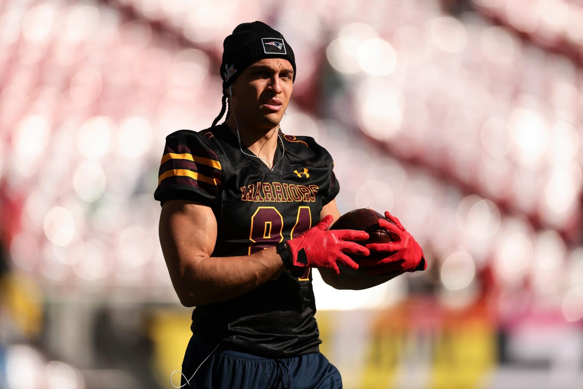 Patriots' receiver shows up to Super Bowl LX in handcuffs while also wearing leg shackles