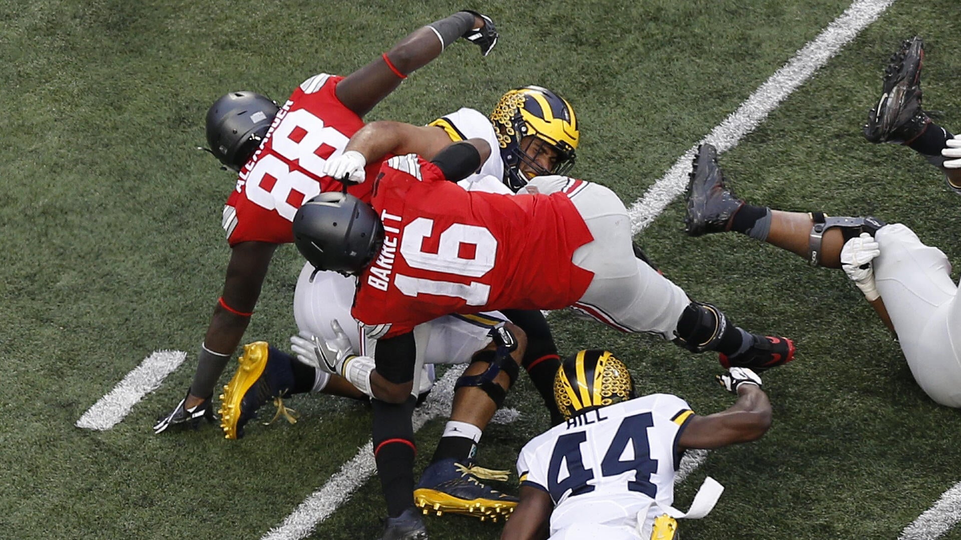 Michigan fans storm field after miracle Hail Mary TD vs Western Michigan