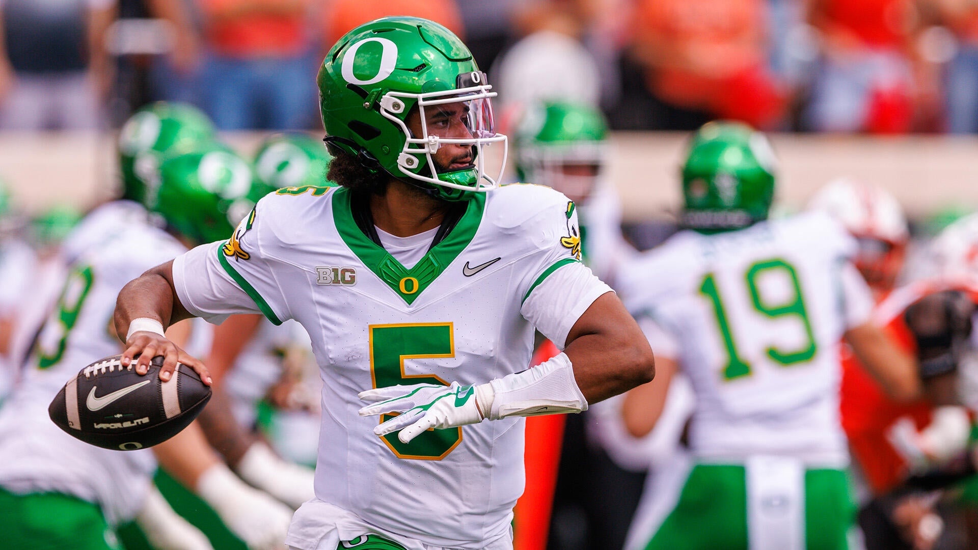 Number five Dante Moore throws a football during Oregon's opener against Oklahoma State.