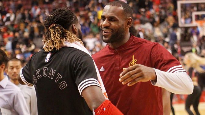 DeMarre Carroll hugs LeBron James