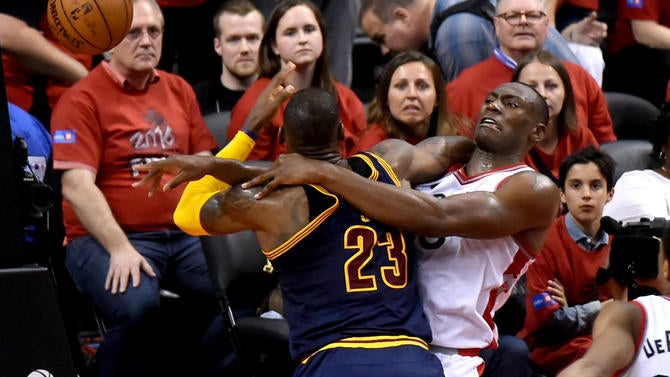 LeBron James and Bismack Biyombo collide