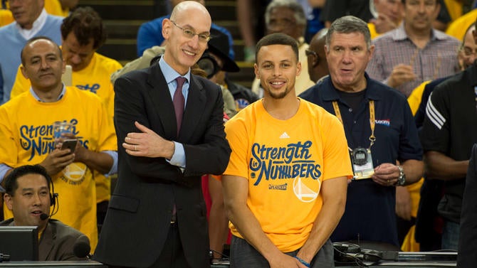 Adam Silver chats with Stephen Curry before his MVP presentation