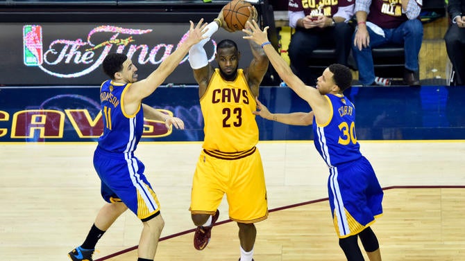 Stephen Curry and Klay Thompson defend LeBron James