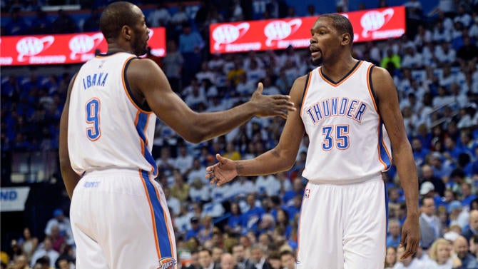 Serge Ibaka and Kevin Durant say hello during the conference finals