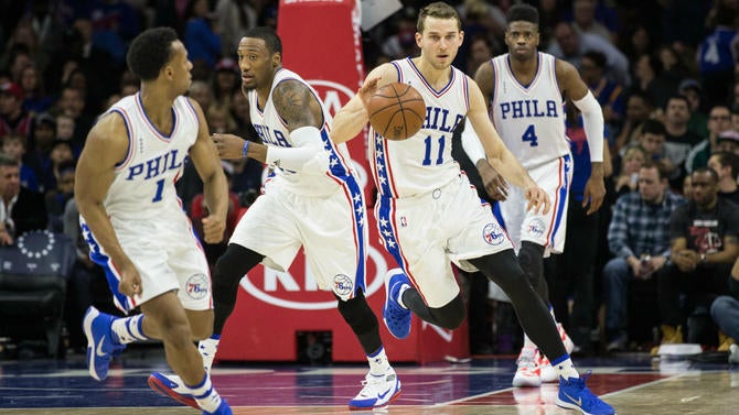 Nik Stauskas dribbles down the court