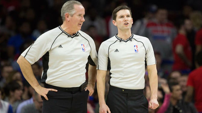 Refs Scott Wall and Ben Taylor have a chat.