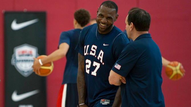 LeBron James has a laugh with Coach K