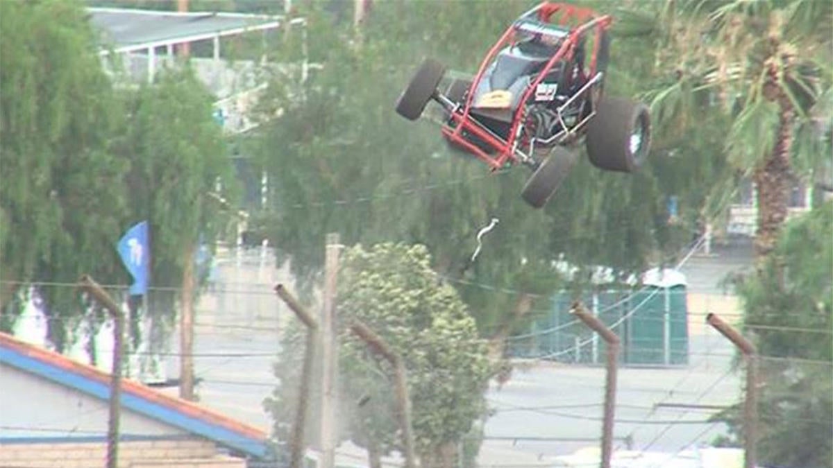 WATCH Sprint car gets huge air after crash, goes flying over fence