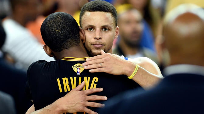 Stephen Curry hugs Kyrie Irving after Game 7