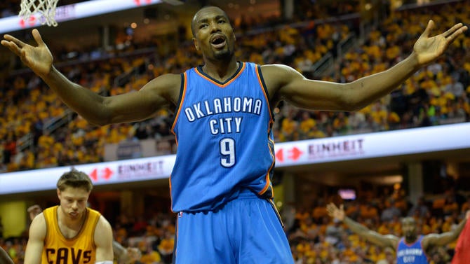 Serge Ibaka raises his arms