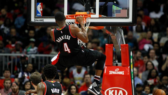 Moe Harkless hangs on the rim