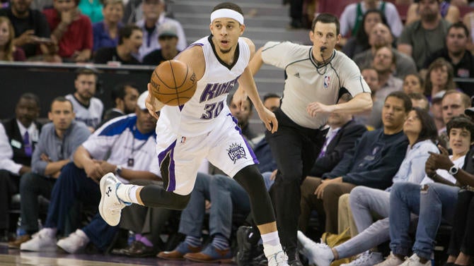 Seth Curry goes up the court