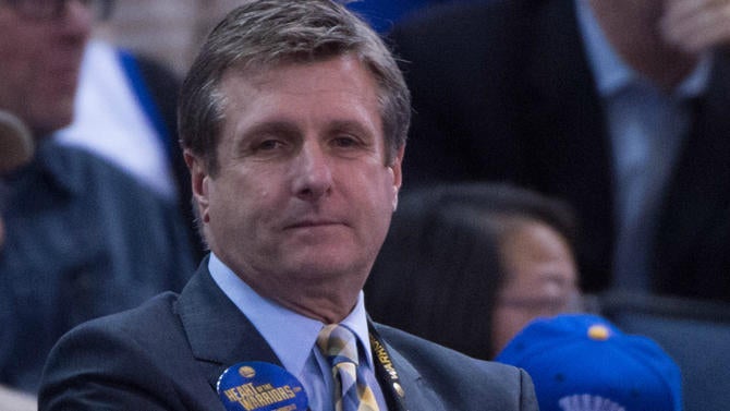 Rick Welts looks on