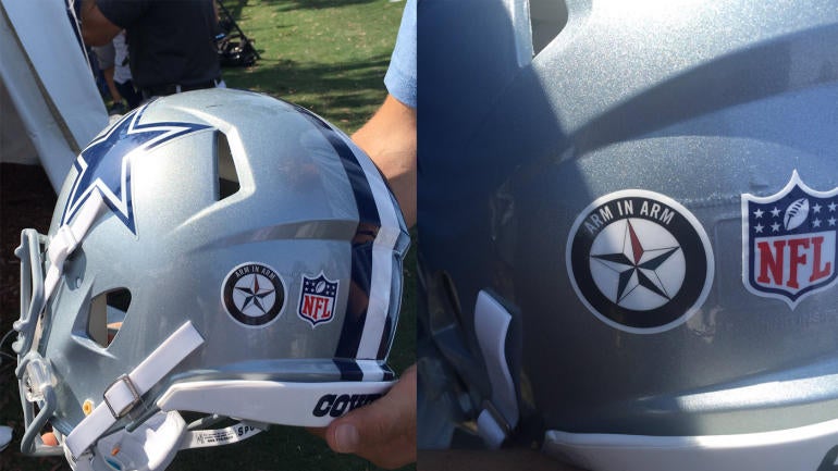 Cowboys honor Dallas police with helmet decal, walk arm-in 