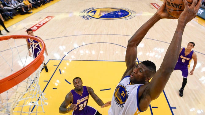 Festus Ezeli dunks against the Lakers