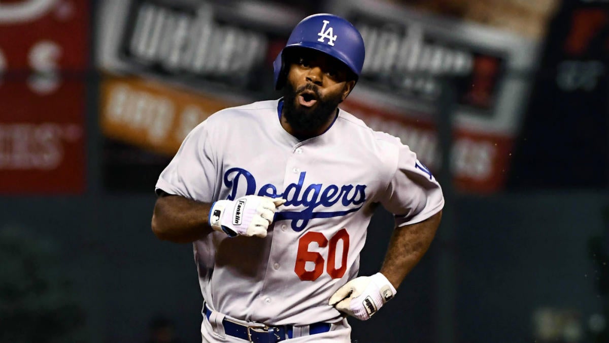 Los Angeles Dodgers' Andrew Toles (60) walks off the field after