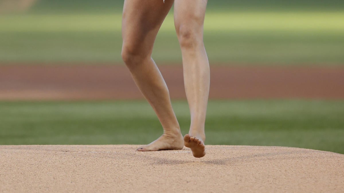 Look Barefoot Olympian Throws First Pitch At Wrigley Field