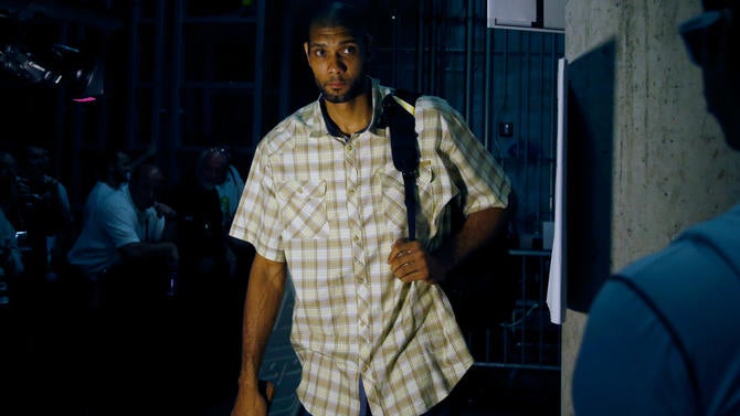 Tim Duncan arrives at an NBA Finals game in 2013