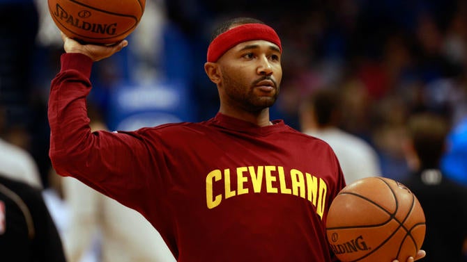 Mo Williams with two basketballs