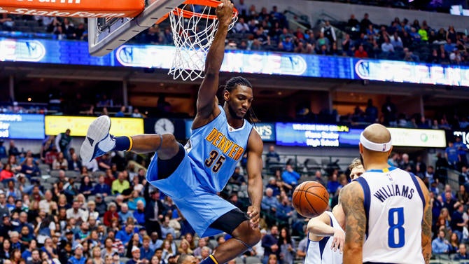 Kenneth Faried hangs on the rim