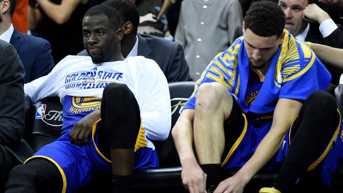 Draymond Green and Klay Thompson looking upset
