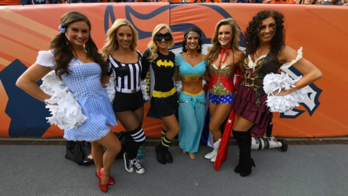 Broncos cheerleader performs in T-rex costume