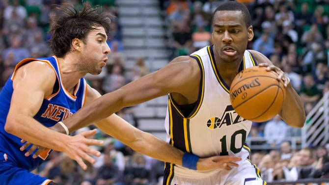 Alec Burks drives against the Knicks