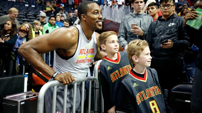 Dwight Howard smiling with fans