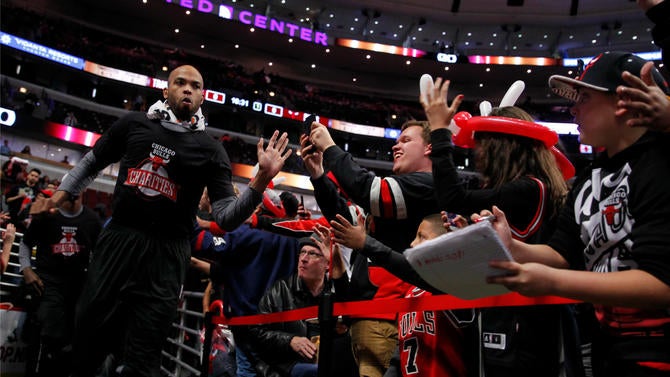 Taj Gibson runs onto the court in Chicago
