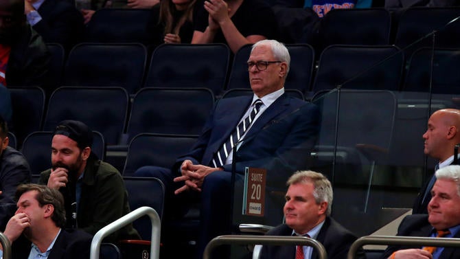 Phil Jackson sits by himself