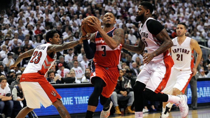 Bradley Beal drives by Raptors