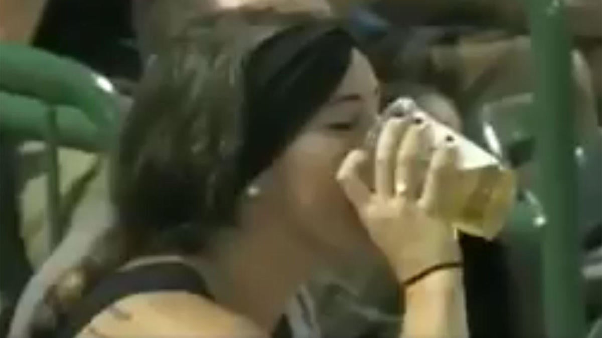 WATCH Fan catches a foul ball in her beer and chugs her drink