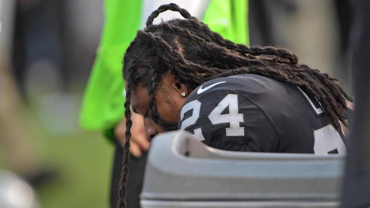 Raiders RB Marshawn Lynch sits during anthem before Rams game